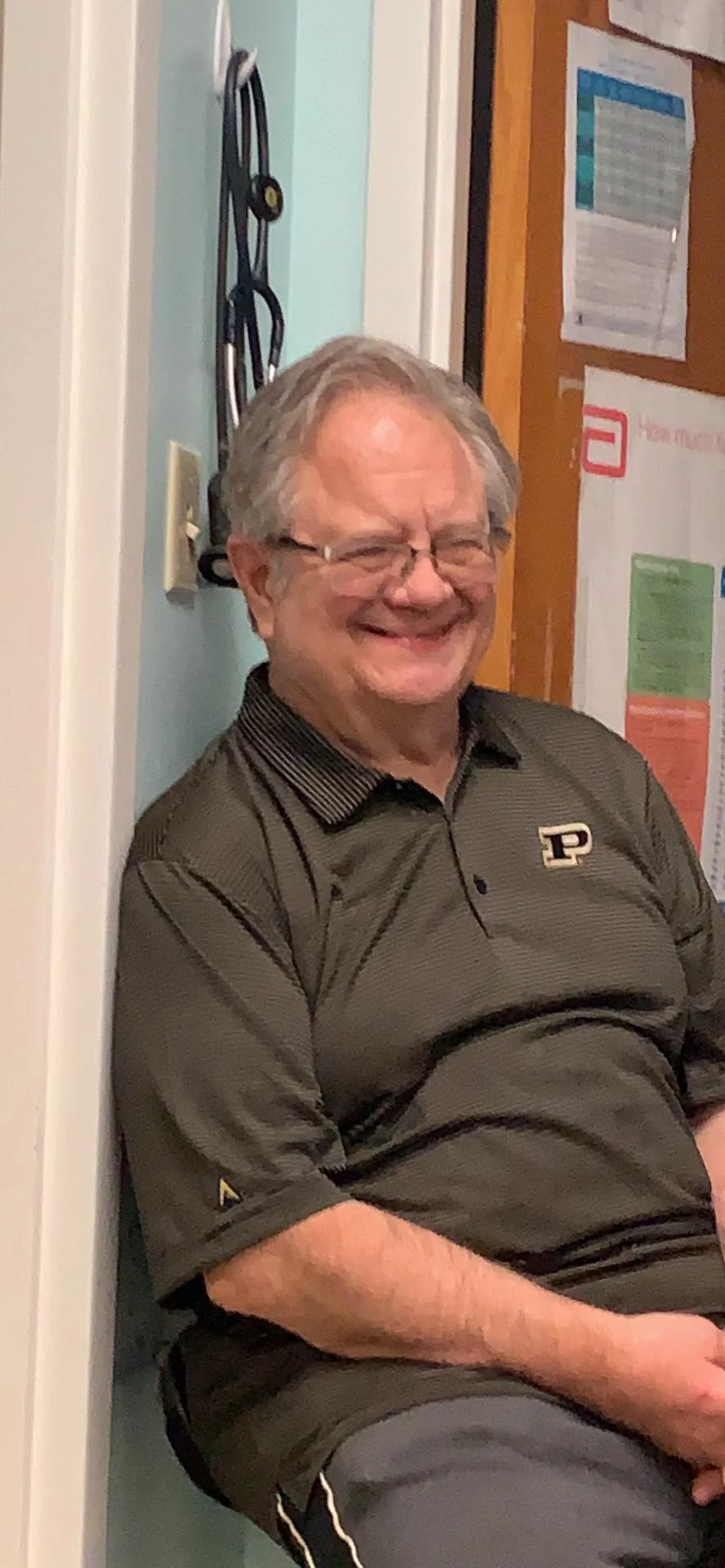 Dr. Gregg Gormley smiling inside Highland Veterinary Clinic.